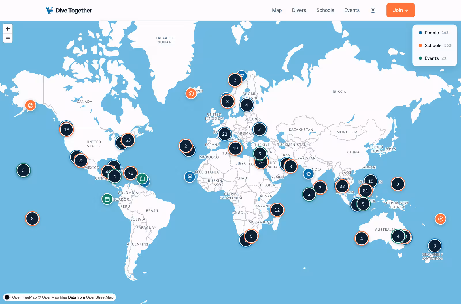The Dive Together world map, showing clustered pins for people, schools, and events across every continent