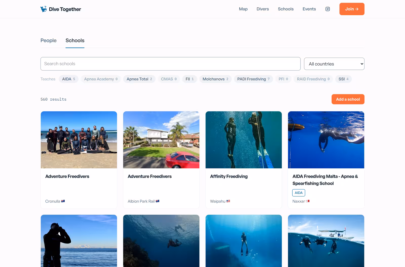 The Dive Together schools directory, showing school cards with cover photos, names, and locations, above filters for the agencies each school teaches